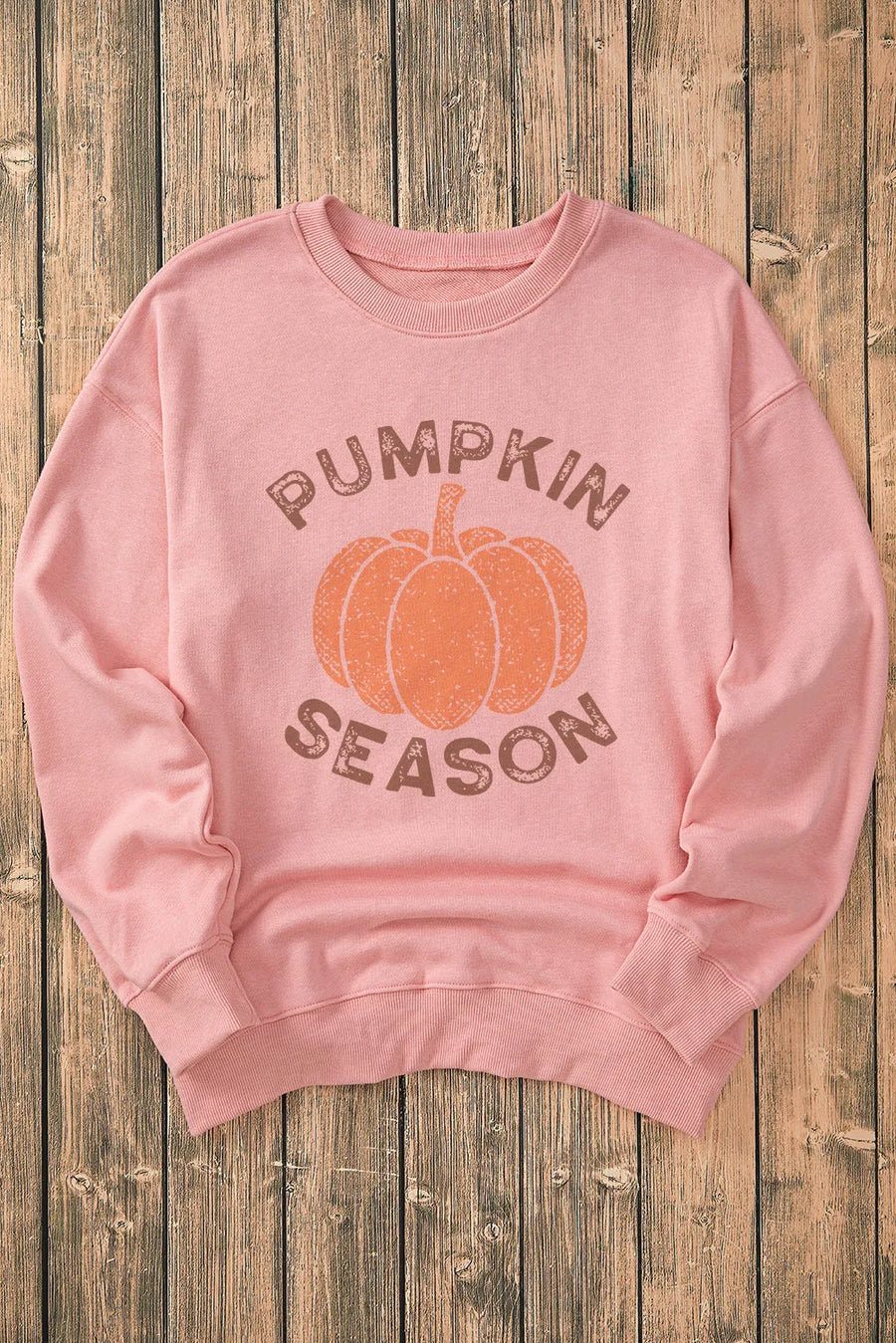 Blush pink crewneck sweatshirt with pumpkin and text graphic
