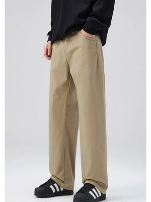 Khaki oversized casual pants with loose fit and cotton blend material.