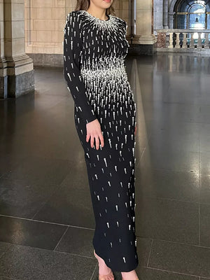 maxi dress in black featuring rhinestone embellishment and fitted fit