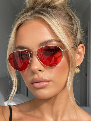 sunglasses in red featuring UV400 protection and aviator fit