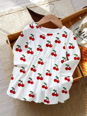 White long sleeve baby dress with allover red cherry print and gathered waist