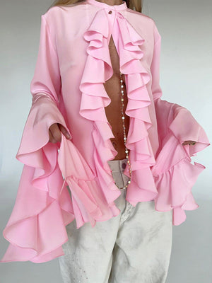 Pink ruffled flounce sleeve blouse with buttoned neckline and airy fabric.