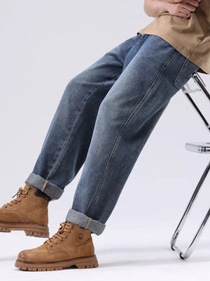 Men's blue vintage wash loose fit jeans with cuffed hems, cotton.