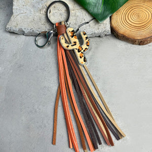 Cactus keyring with leopard print detail and multi-color leather tassels.