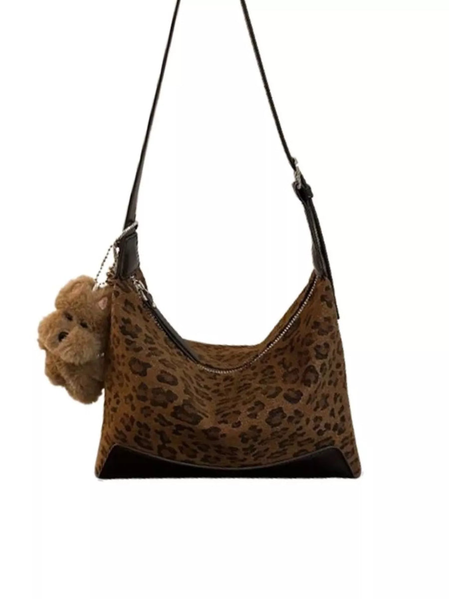 Leopard print shoulder bag with adjustable strap and teddy bear charm