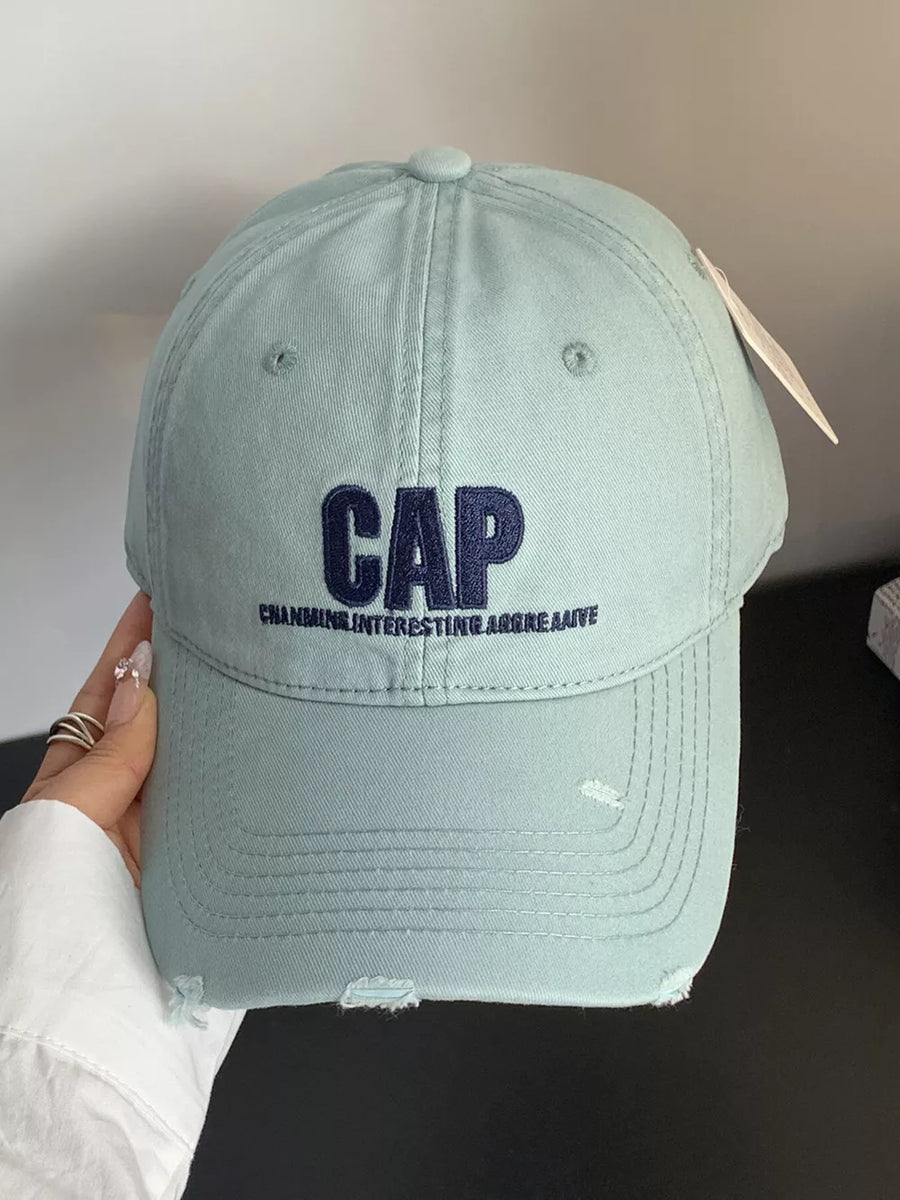 Mint green distressed cotton baseball hat with embroidered CAP and text.