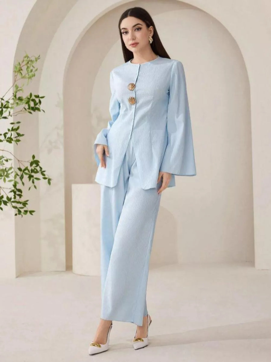 Light blue crinkled texture two-piece set with shell buttons and wide leg pants.