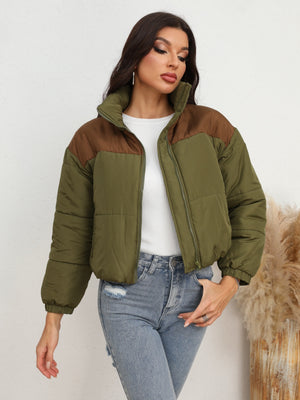 Colorblock cropped puffer jacket in army green with brown accents, stand collar, and zip front.