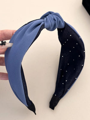 Denim knot headband in medium blue with crystal detail on dark gray band.