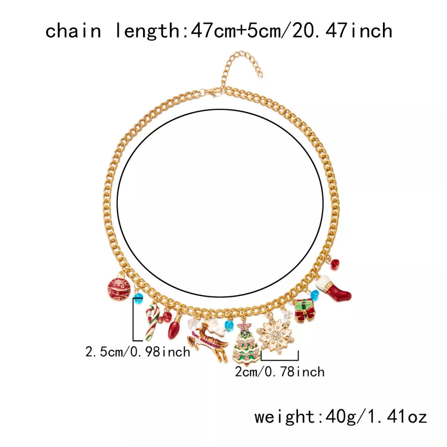Gold charm necklace with Christmas icons like trees, stockings, and candy canes.