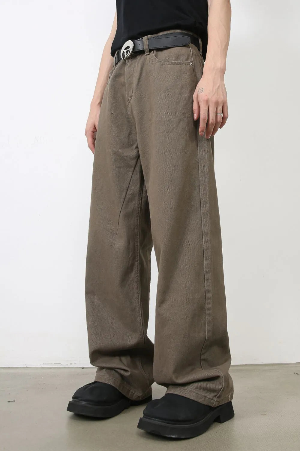 Taupe wide-leg denim trousers with a relaxed fit and casual styling.