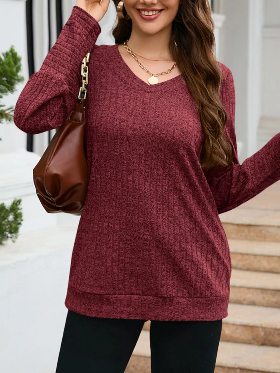 Textured red V-neck knit long-sleeve sweater top with ribbed detail.