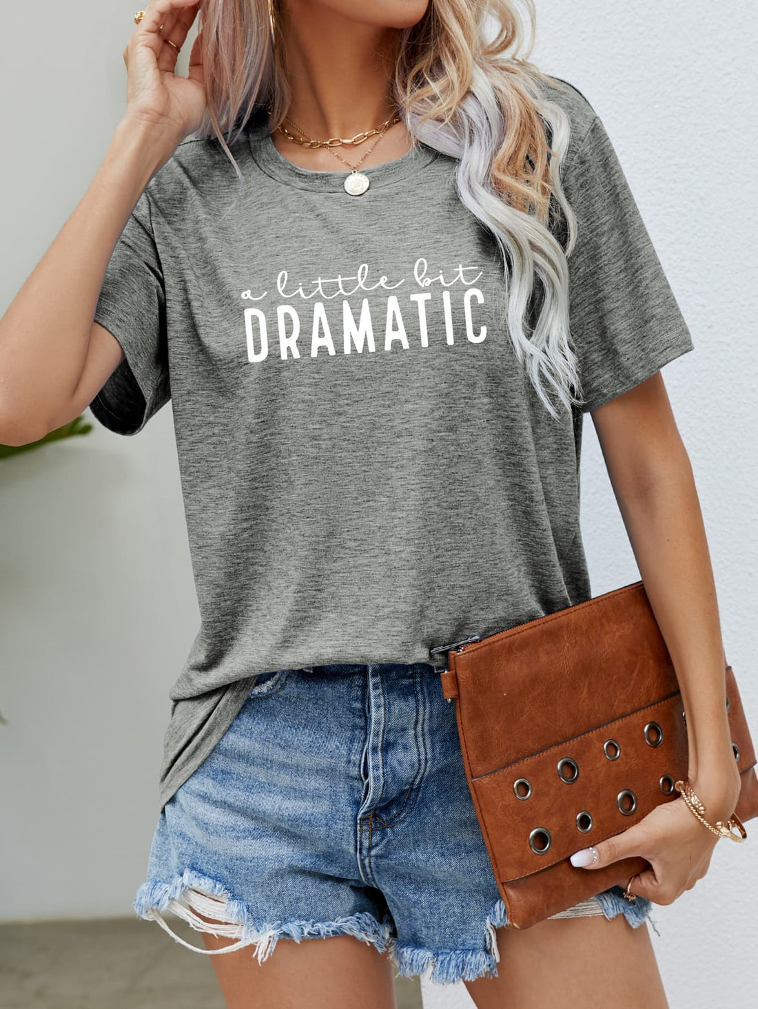 Heather gray crew neck tee with white "a little bit DRAMATIC" graphic text.