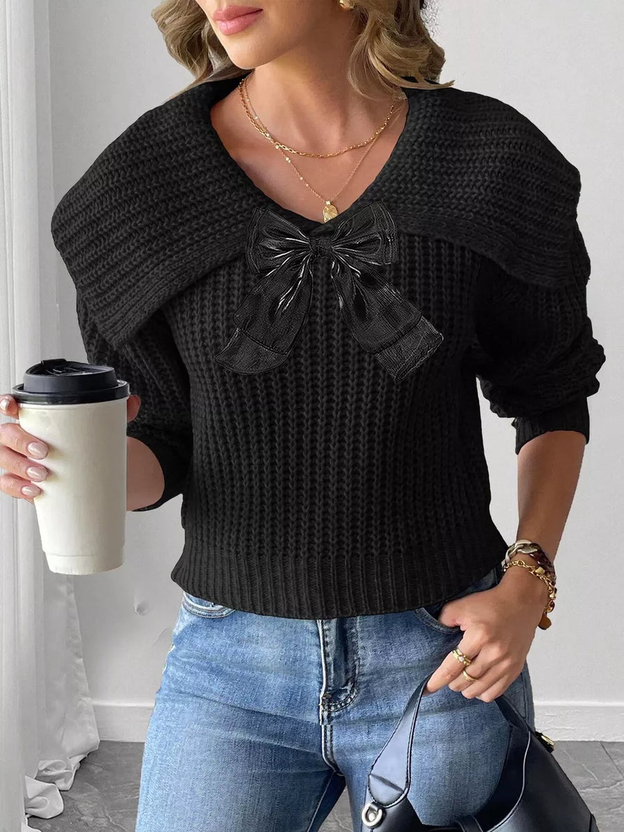 black pullover sweater with bow detail and long sleeve