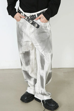 Brushstroke denim wide leg jeans in light with raw hem and abstract grey pattern.
