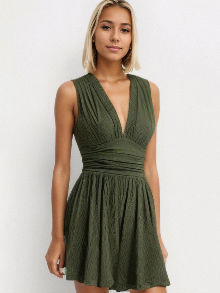 Textured ribbed plunge romper in army green with a cinched waist and flared skirt.