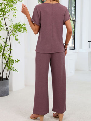 Plum purple waffle knit two-piece set with short sleeve top and wide leg pants.