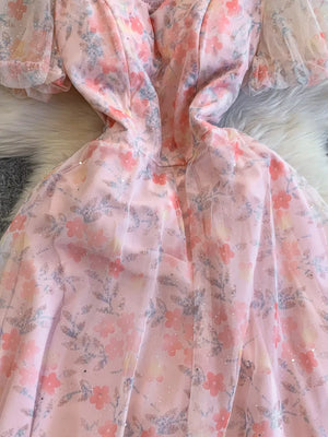 Light pink floral maxi dress with sweetheart neckline and sheer puff sleeves.