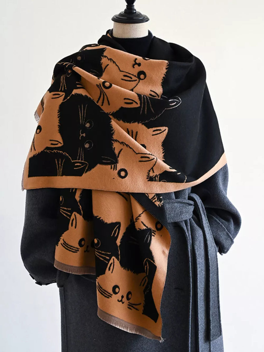 Reversible scarf with black and tan cat pattern, fringed edges.