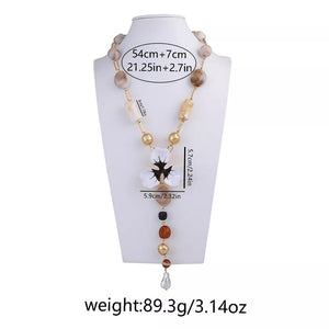 necklace featuring floral in brown with 18K Gold-Plated, Resin, Zinc alloy Care instructions: Imported Size &amp texture