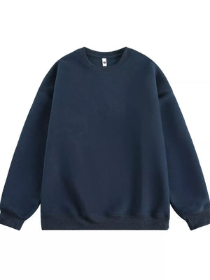Navy blue oversized crew-neck sweatshirt with ribbed cuffs and hem.
