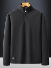 Dark Gray quarter zip sweatshirt with a mock neck and subtle logo detail.