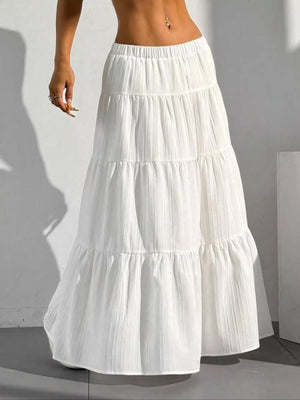 White tiered maxi skirt with elastic waistband and subtle vertical texture