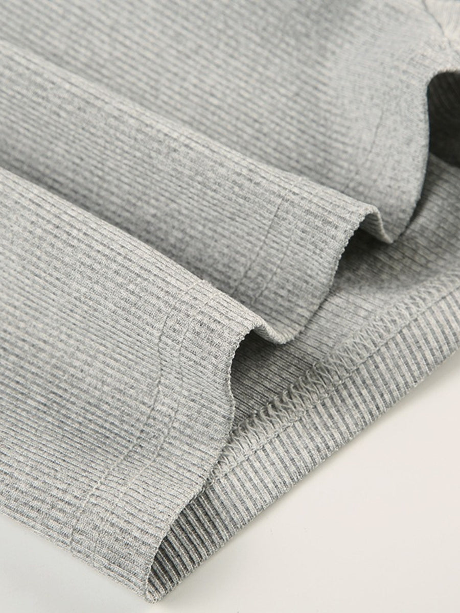 Gray ribbed long sleeve buttoned romper detail