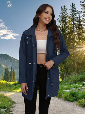Navy blue drawstring snap-down trench coat with zipper and pockets.