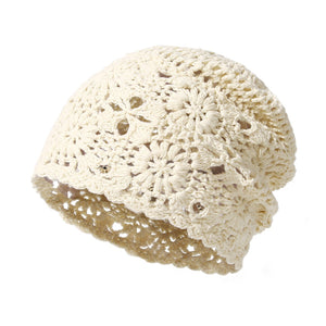 Beige crochet slouchy beanie with floral pattern and scalloped edge.