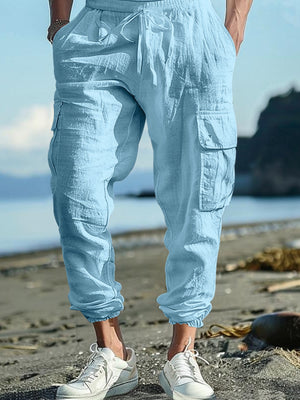 Light blue cargo pants with drawstring waist and elastic cuffs, featuring multiple pockets.