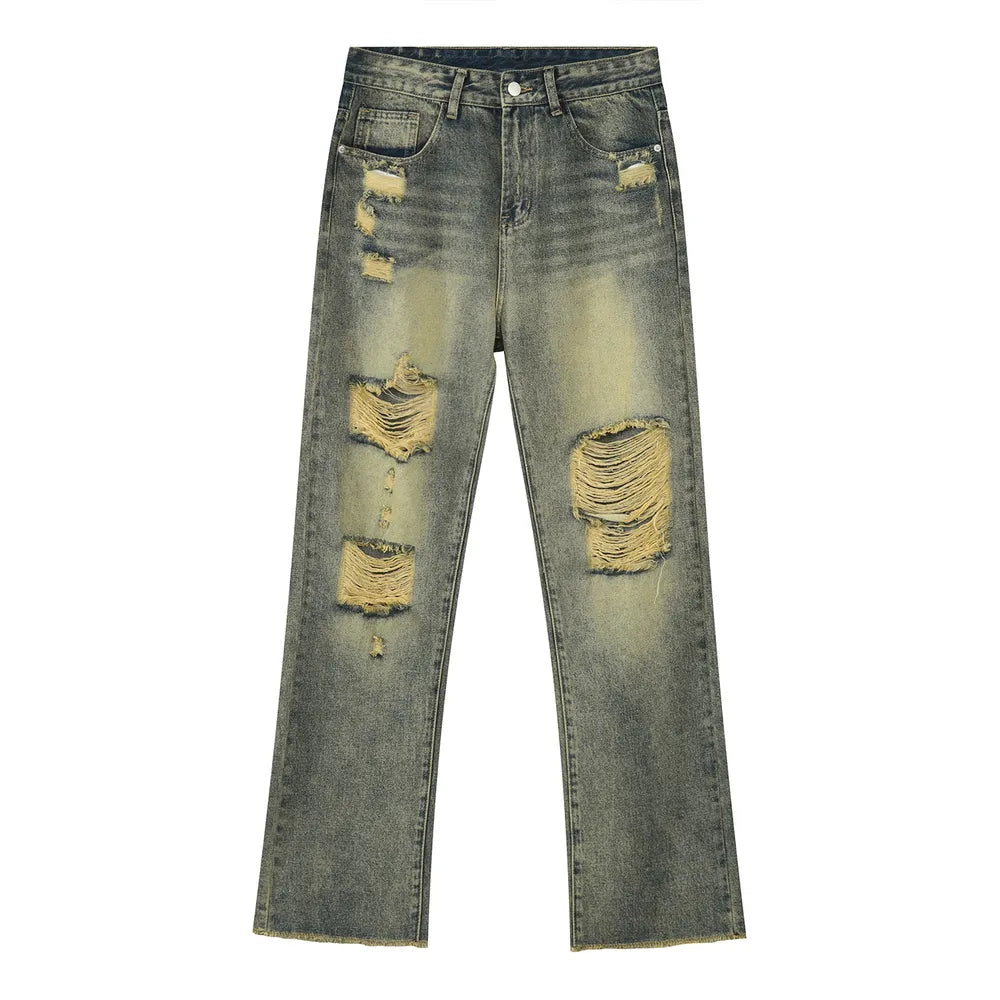 Distressed baggy jeans in medium wash cotton with shredded knees and raw hem.