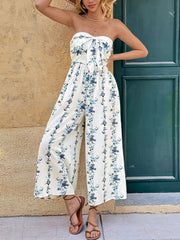Floral smocked tie-front wide-leg romper in white with blue floral print, strapless neckline.