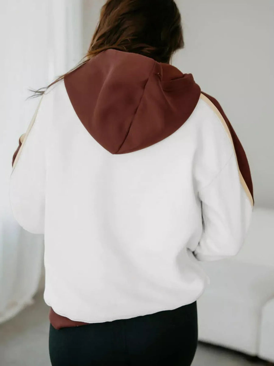 Hooded sweatshirt in dark brown and white patchwork with stripe detail on sleeves.