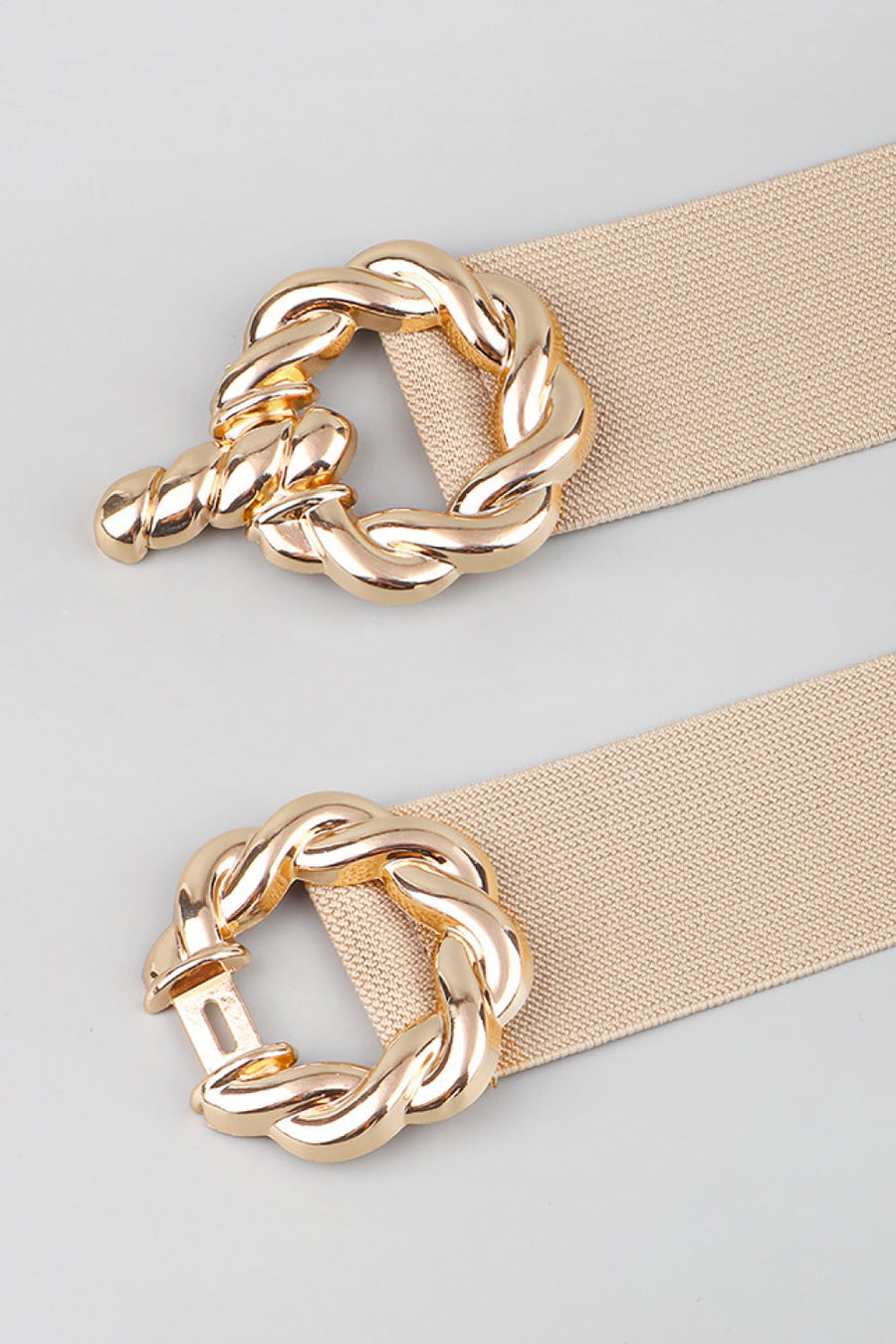 Braided knot stretch belt in tan with gold alloy buckle detail.