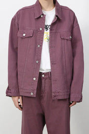 Burgundy denim trucker jacket with button front and chest pockets.