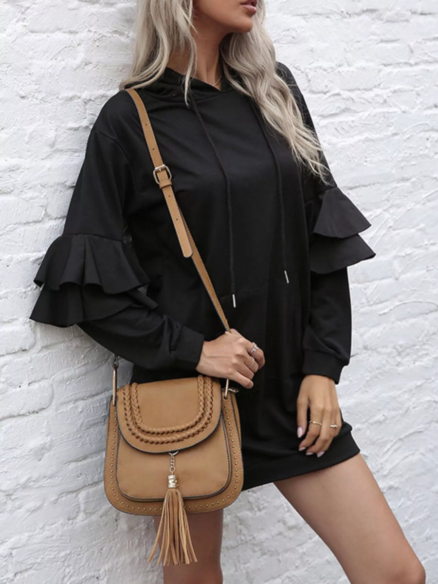 Black hooded mini dress with tiered ruffle sleeves and drawstring hood.