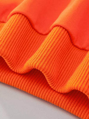 Orange children's sweatshirt with ribbed cuffs and hem detail