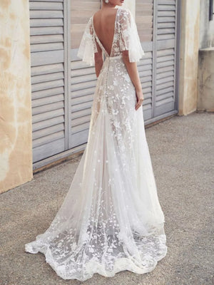 White lace flutter sleeve v-neck dress with floral embroidery and train.