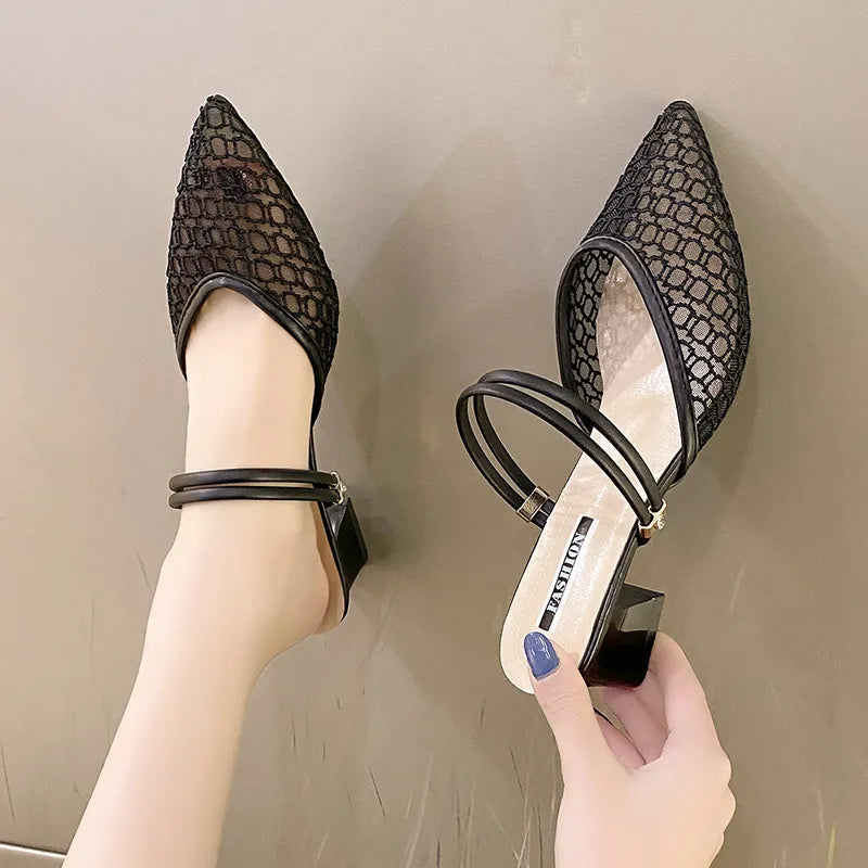 Black lace slingback pointed-toe mules with double ankle straps and block heel.