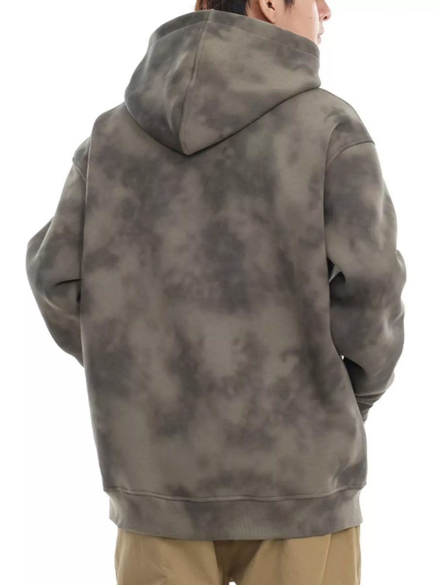 Oversized tie-dye hoodie in Cement Gray with a drawstring hood and cuffed hem.
