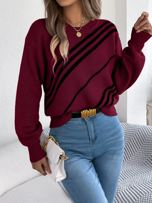 Red acrylic blend sweater with black diagonal stripes and round neck.