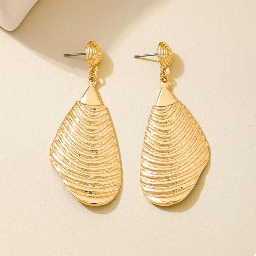 Textured gold dangle earrings with a unique ribbed design.