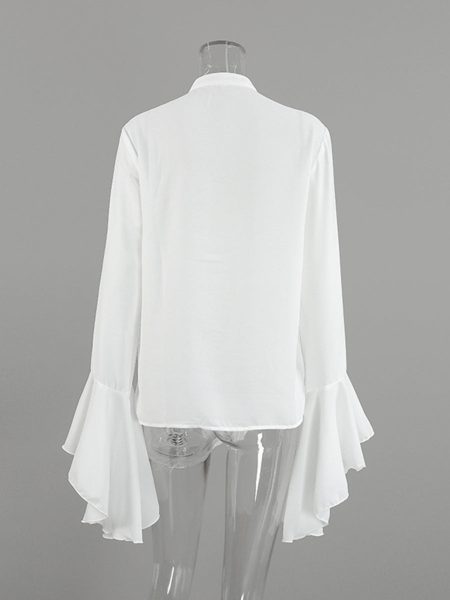 White ruffled flounce sleeve blouse with buttoned front detail.