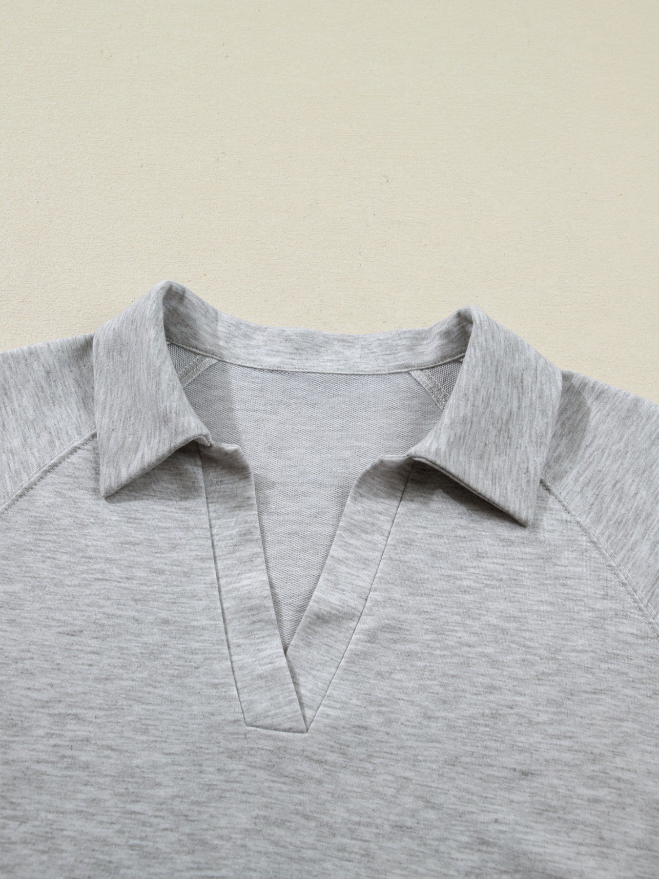 Grey polo collar loungewear top with V-neck detail in soft polyester fabric.