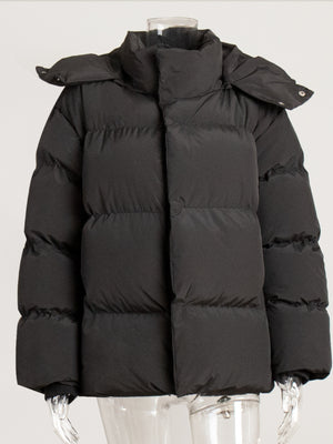 Black puffer jacket with hood and snap closure