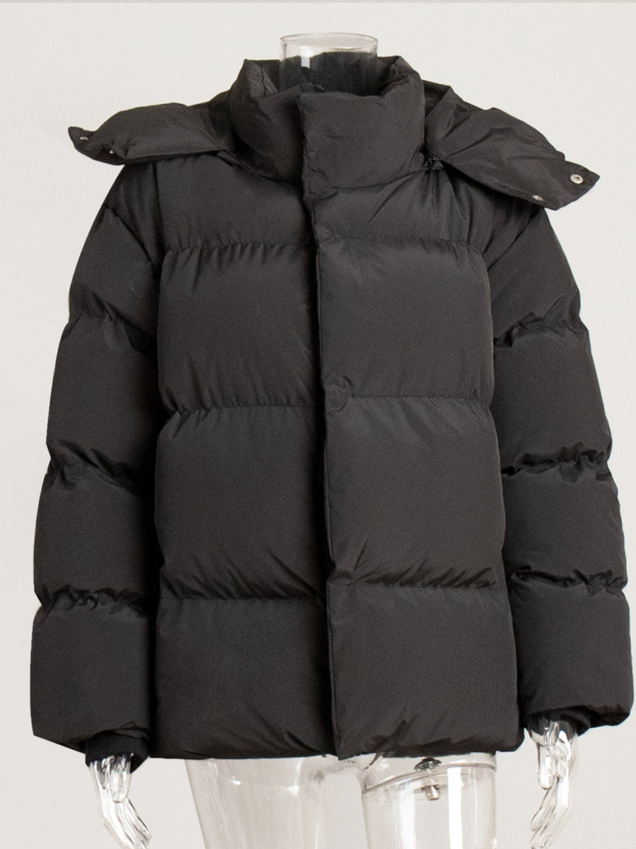 Black puffer jacket with hood and snap closure