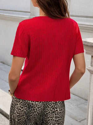 Red short-sleeve buttoned cardigan with a textured knit and crew neck.