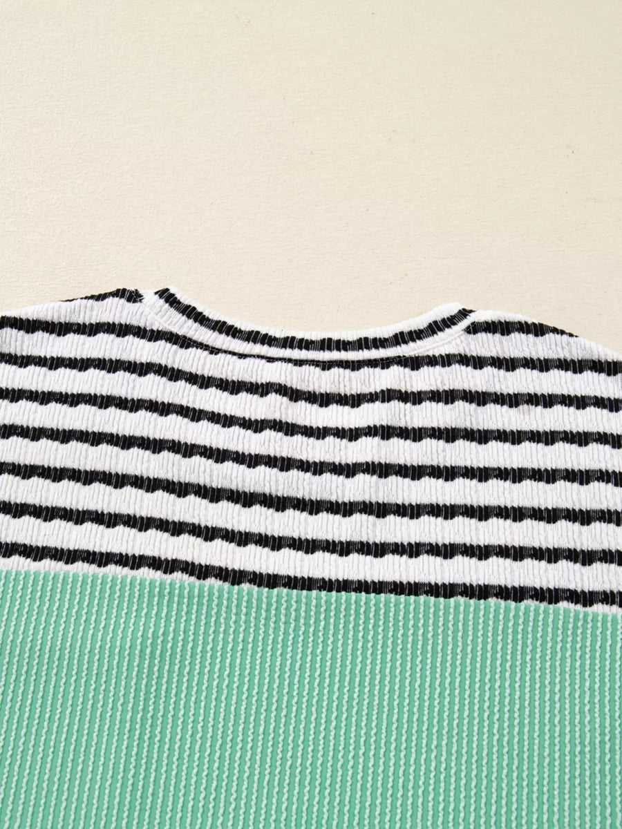 Turquoise and black striped ribbed long-sleeve top with a crew neck.