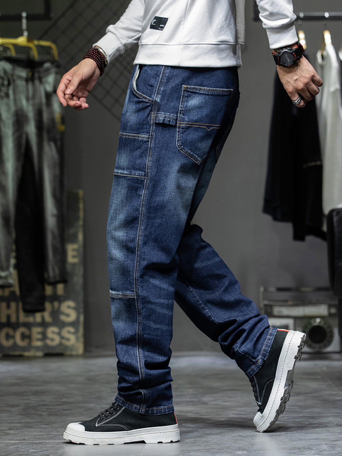 Men's dark blue 100% cotton cargo jeans with relaxed fit and visible pocket details.